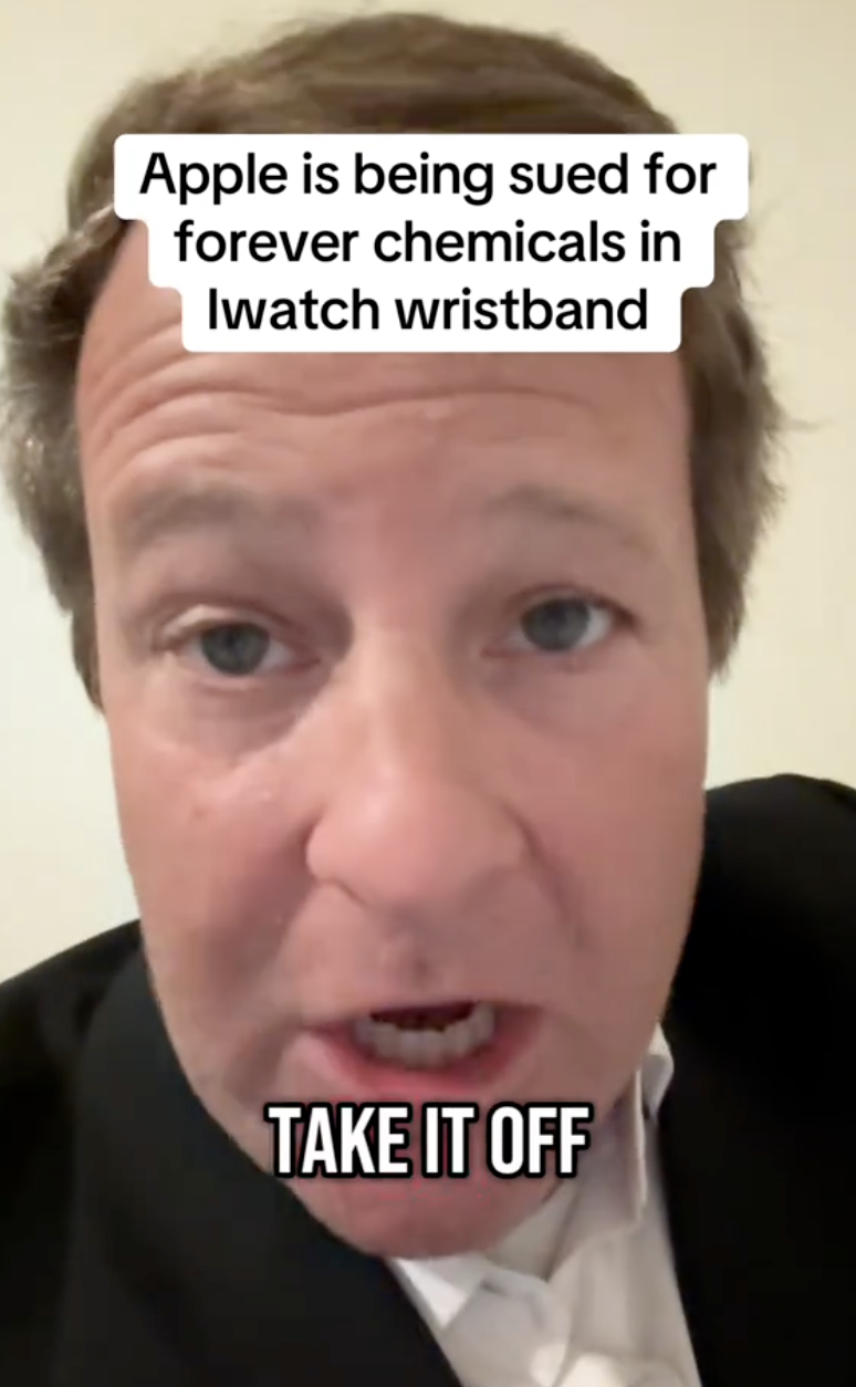 man in a suit talking about apple watches